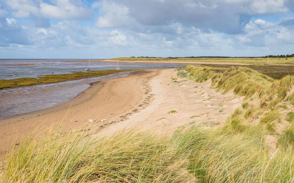 Hightown beach backed by sand dunes leading to the top of River Alt near Liverpool.