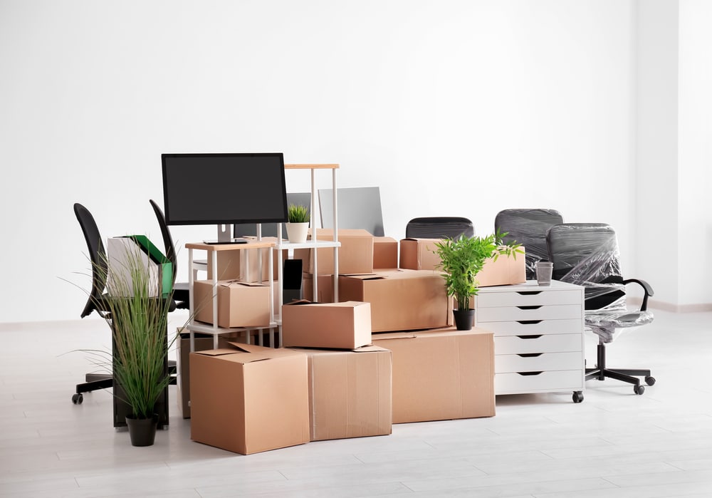 piled up furniture and boxes