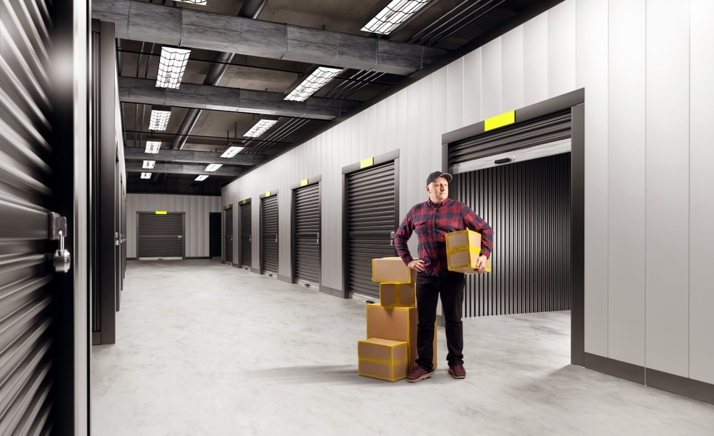 man standing outside storage lock up